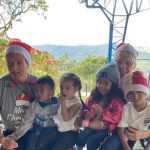 children and volunteers in Medellin Colombia around Holidays